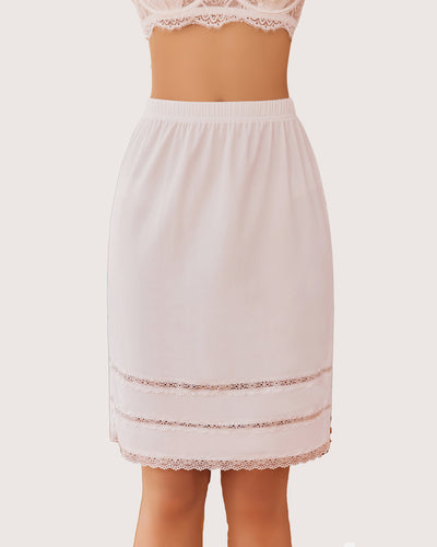 Nude knee-length half slip with floral lace trim and elastic waistband, back view.