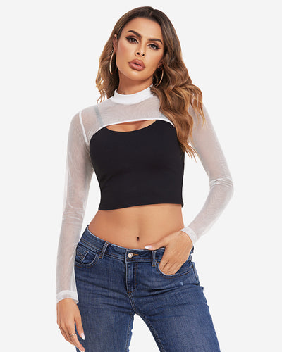 Model in green mock neck long sleeve crop top with sheer cutout and blue high-waisted jeans.