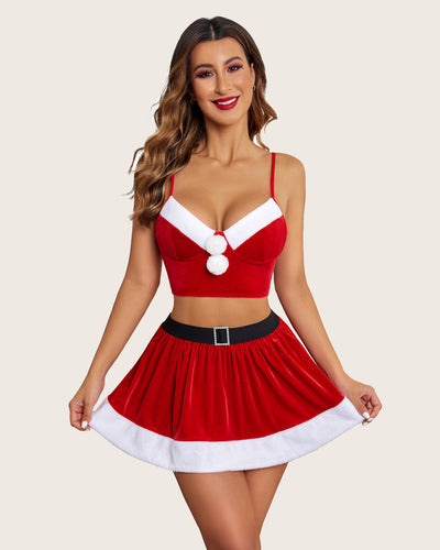 Green velvet Santa outfit for women with crop top and flared skirt, adorned with a Santa hat.