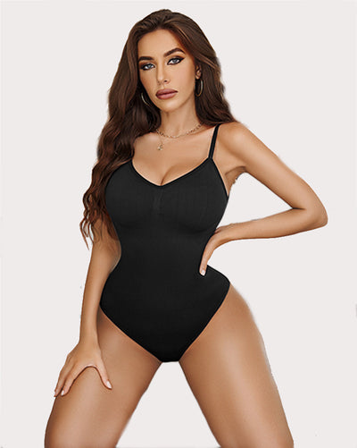 Nude v-neck bodysuit on model, highlighting its flattering curves and adjustable straps.